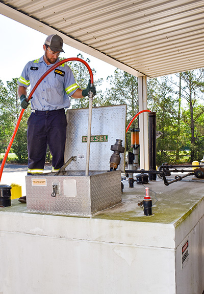 Technician recycling the diesel fuel from the Envirvault tank.